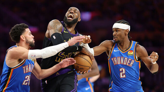 LOS ANGELES, CALIFORNIA - MAY 11: LeBron James #23 of the Los Angeles Lakers drives with the ball against Shai Gilgeous-Alexander #2 and Ajay Mitchell #25 of the Oklahoma City Thunder in Game Four of the Second Round of the NBA Western Conference Playoffs at Crypto.com Arena on May 11, 2026 in Los Angeles, California.