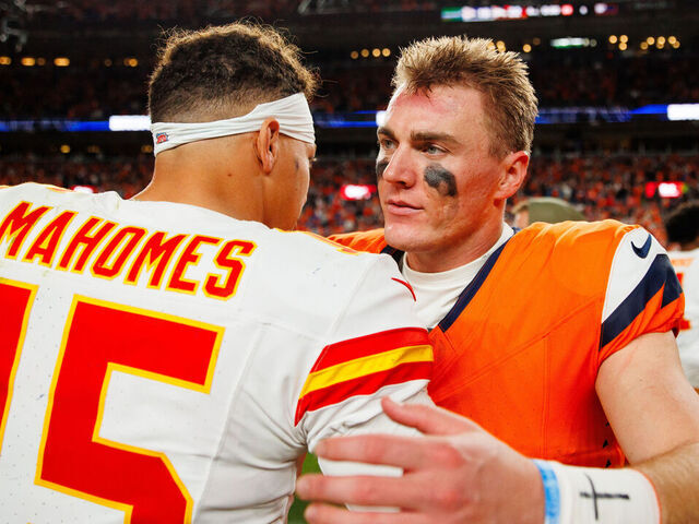 DENVER, CO - NOVEMBER 16: Patrick Mahomes #15 of the Kansas City Chiefs and Bo Nix #10 of the Denver Broncos talk after the game at Empower Field at Mile High on November 16, 2025 in Denver, Colorado.