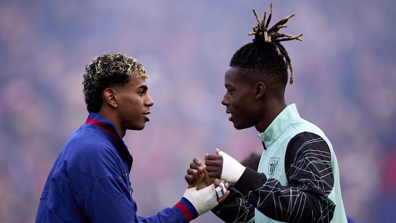 BARCELONA, SPAIN - NOVEMBER 22: Lamine Yamal of FC Barcelona greets Nico Williams of Athletic Club during the LaLiga EA Sports match between FC Barcelona and Athletic Club at Spotify Camp Nou on November 22, 2025 in Barcelona, Spain.
