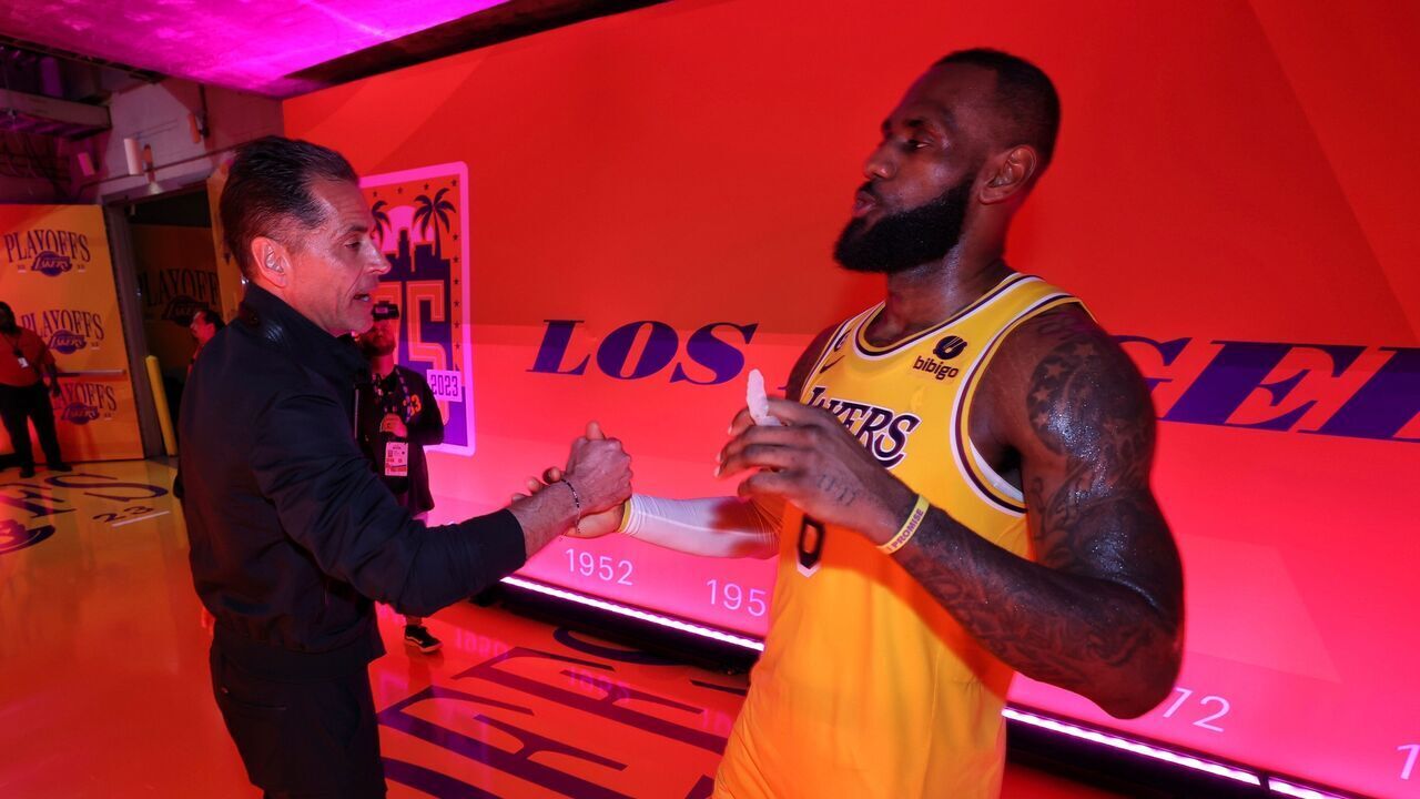LOS ANGELES, CA - MAY 9: LeBron James #6 of the Los Angeles Lakers greets Rob Pelinka after Round 2 Game 4 of the Western Conference Semi-Finals 2023 NBA Playoffs against the Golden State Warriors on May 9, 2023 at Crypto.Com Arena in Los Angeles, California. NOTE TO USER: User expressly acknowledges and agrees that, by downloading and/or using this Photograph, user is consenting to the terms and conditions of the Getty Images License Agreement. Mandatory Copyright Notice: Copyright 2023 NBAE