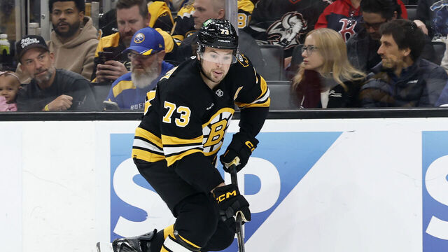 BOSTON, MA - MAY 01: Charlie McAvoy #73 of the Boston Bruins picks up the puck during game 6 of the Stanley Cup Playoffs First Round between the Boston Bruins and the Buffalo Sabres on May 1, 2026, at TD Garden in Boston, Massachusetts.