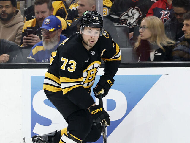 BOSTON, MA - MAY 01: Charlie McAvoy #73 of the Boston Bruins picks up the puck during game 6 of the Stanley Cup Playoffs First Round between the Boston Bruins and the Buffalo Sabres on May 1, 2026, at TD Garden in Boston, Massachusetts.