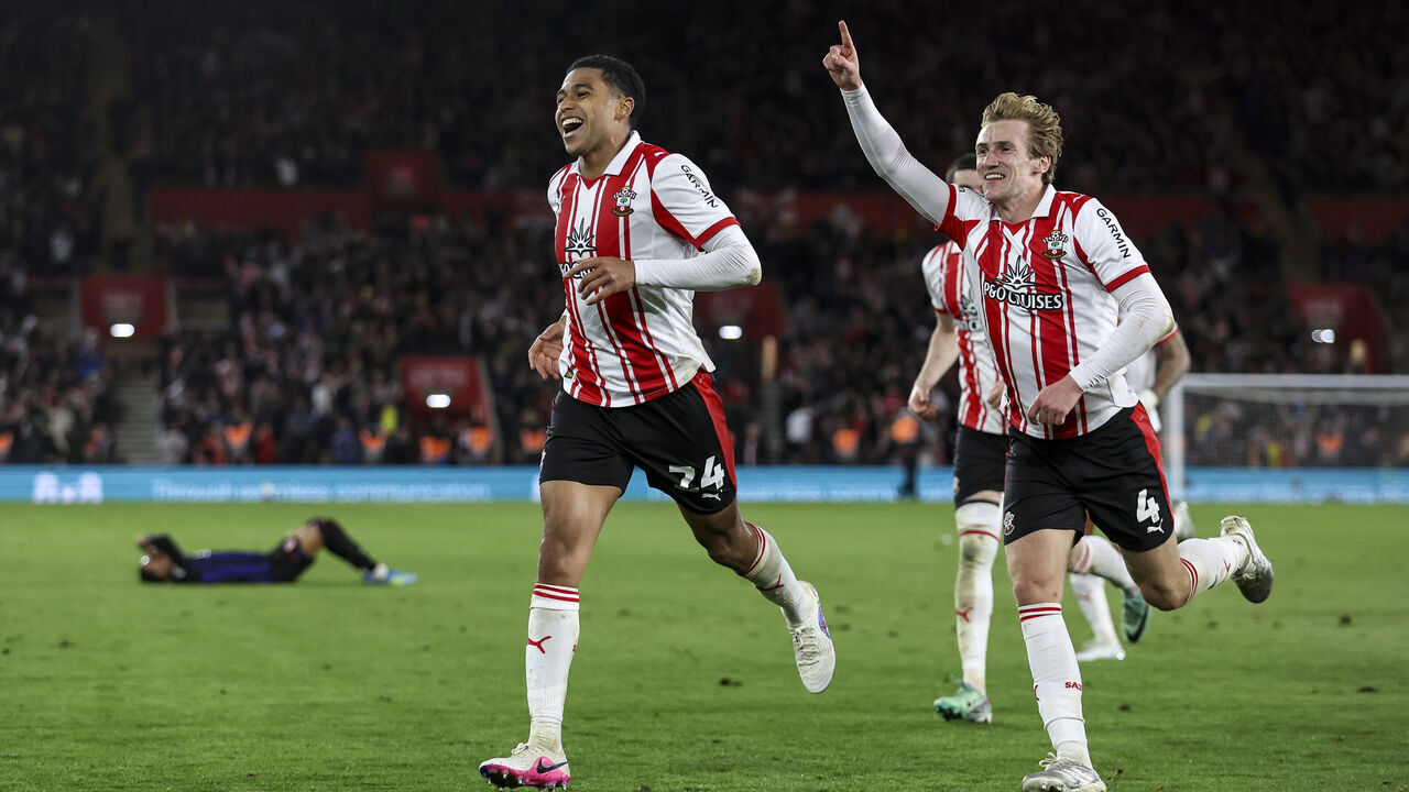 SOUTHAMPTON, ENGLAND - MAY 12: Flynn Downes of Southampton rushes to congratulate team-mate Shea Charles after he scores a goal to make it 2-1 in extra-time during the Sky Bet Championship Play Off Semi Final Second Leg match between Southampton and Middlesbrough at St Mary's Stadium on May 12, 2026 in Southampton, England.