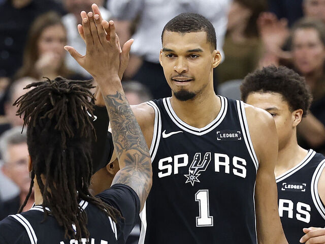 SAN ANTONIO, TEXAS - MAY 12: Victor Wembanyama #1 and Stephon Castle #5 of the San Antonio Spurs high five each other during the second quarter against the Minnesota Timberwolves in Game Five of the Second Round of the NBA Western Conference Playoffs at Frost Bank Center on May 12, 2026 in San Antonio, Texas.