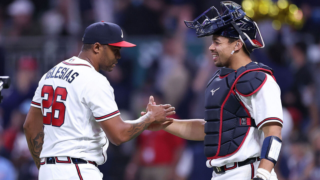 ATLANTA, GEORGIA - MAY 12: Raisel Iglesias #26 and Drake Baldwin #30 of the Atlanta Braves react after their 5-2 win over the Chicago Cubs at Truist Park on May 12, 2026 in Atlanta, Georgia.