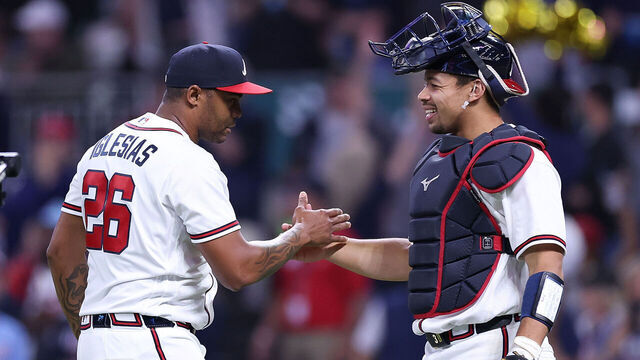 ATLANTA, GEORGIA - MAY 12: Raisel Iglesias #26 and Drake Baldwin #30 of the Atlanta Braves react after their 5-2 win over the Chicago Cubs at Truist Park on May 12, 2026 in Atlanta, Georgia.