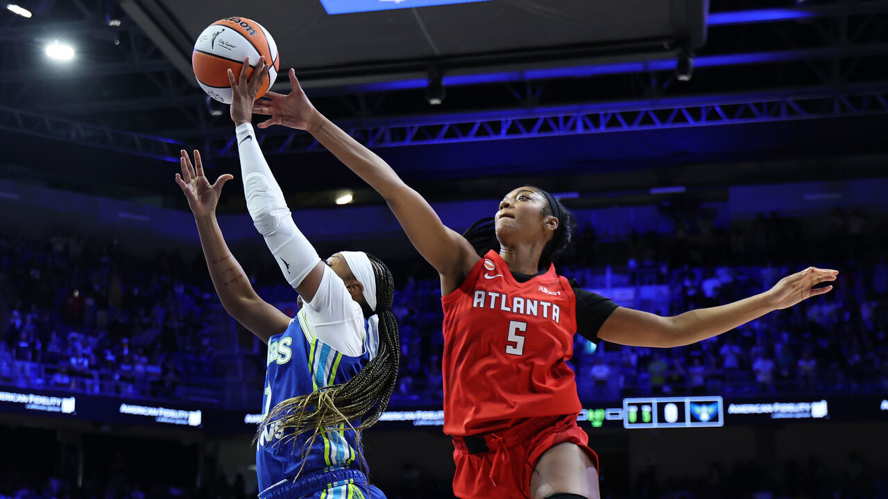 ARLINGTON, TEXAS - MAY 12: Angel Reese #5 of the Atlanta Dream blocks a shot Odyssey Sims #1 of the Dallas Wings during the first half at College Park Center on May 12, 2026 in Arlington, Texas. NOTE TO USER: User expressly acknowledges and agrees that, by downloading and or using this photograph, User is consenting to the terms and conditions of the GettyImages License Agreement.