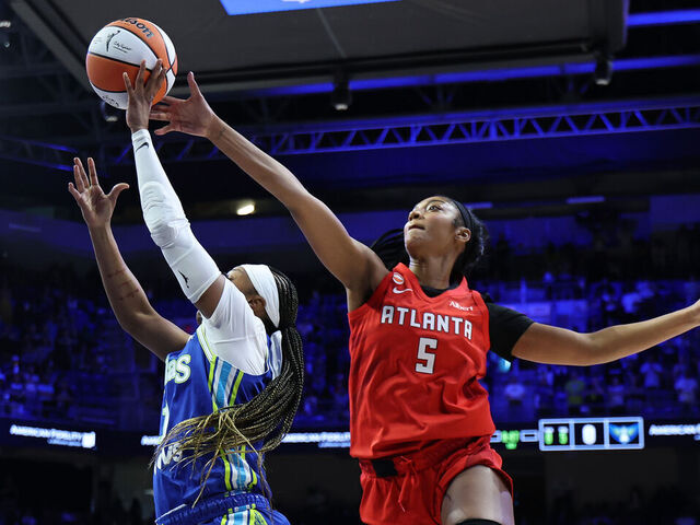 ARLINGTON, TEXAS - MAY 12: Angel Reese #5 of the Atlanta Dream blocks a shot Odyssey Sims #1 of the Dallas Wings during the first half at College Park Center on May 12, 2026 in Arlington, Texas. NOTE TO USER: User expressly acknowledges and agrees that, by downloading and or using this photograph, User is consenting to the terms and conditions of the GettyImages License Agreement.