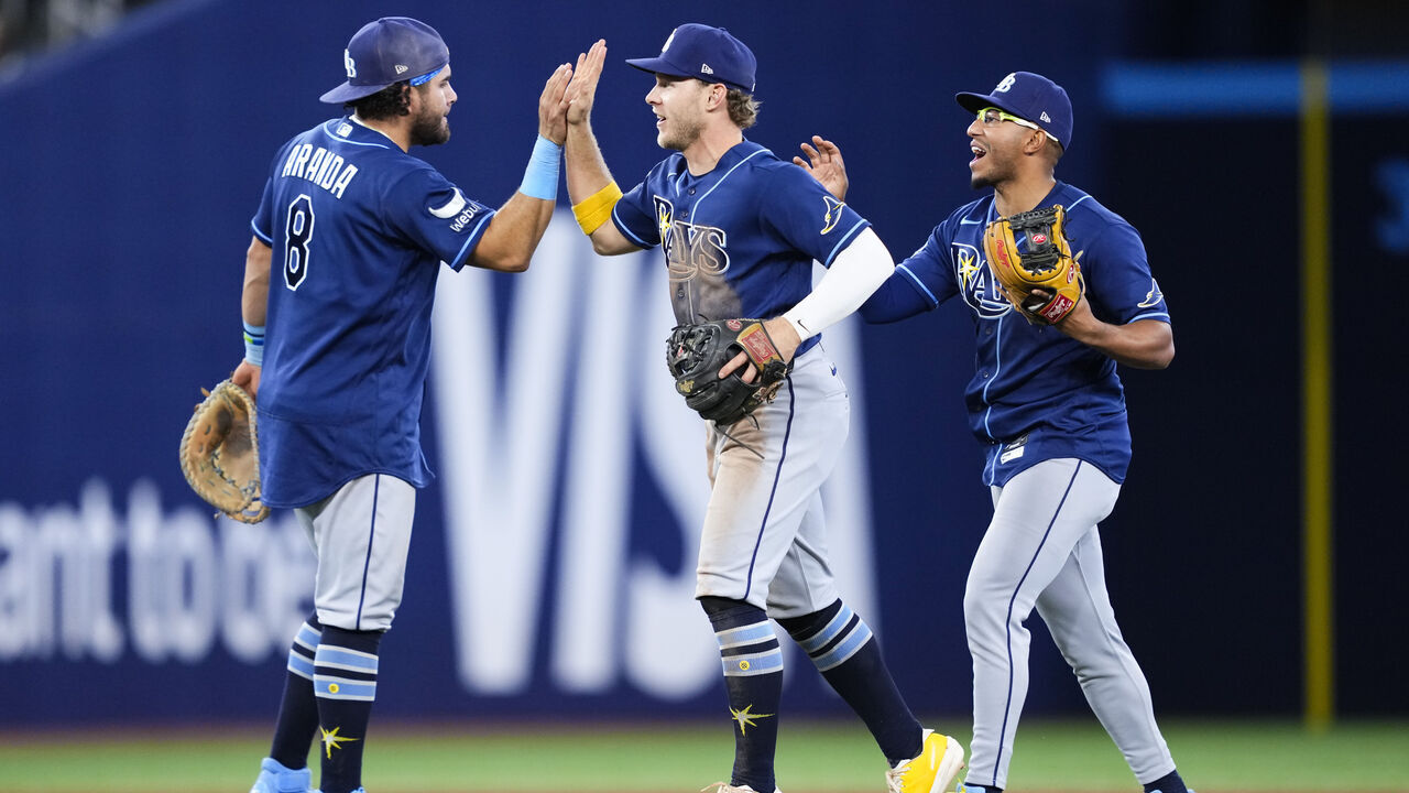 TORONTO, CANADA - MAY 12: (L-R) Jonathan Aranda #8, Taylor Walls #6 and Richie Palacios #1 of the Tampa Bay Rays celebrate defeating the Toronto Blue Jays in their MLB game at the Rogers Centre on May 12, 2026 in Toronto, Ontario, Canada.