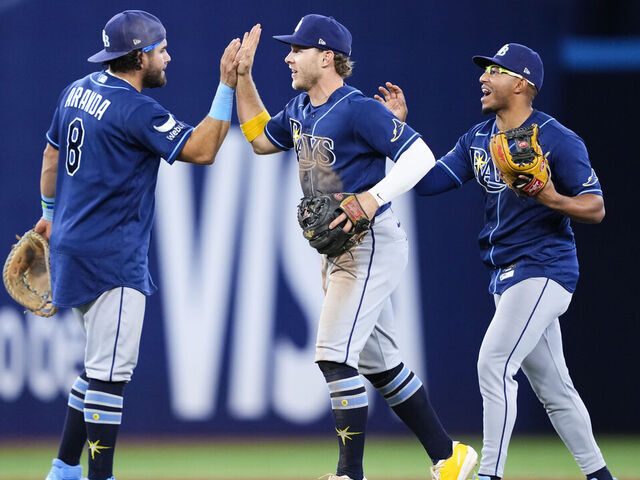TORONTO, CANADA - MAY 12: (L-R) Jonathan Aranda #8, Taylor Walls #6 and Richie Palacios #1 of the Tampa Bay Rays celebrate defeating the Toronto Blue Jays in their MLB game at the Rogers Centre on May 12, 2026 in Toronto, Ontario, Canada.