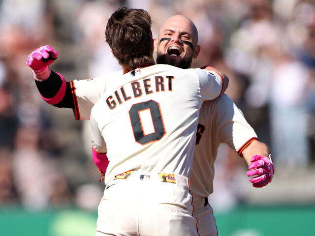 SAN FRANCISCO, CALIFORNIA - MAY 10: Drew Gilbert #0 of the San Francisco Giants embraces Jesus Rodriguez #79 of the San Francisco Giants after Rodriguez walk off single during the 12th inning against the Pittsburgh Pirates at Oracle Park on May 10, 2026 in San Francisco, California.