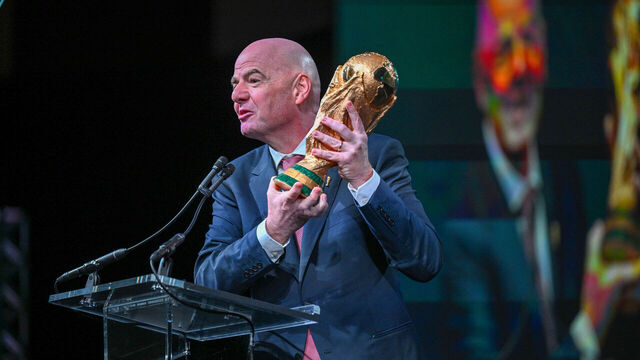 WASHINGTON, DC - JANUARY 29: FIFA President Gianni Infantino holds the FIFA World Cup winner's trophy at The United States Conference of Mayors on January 29, 2026 in Washington, DC.