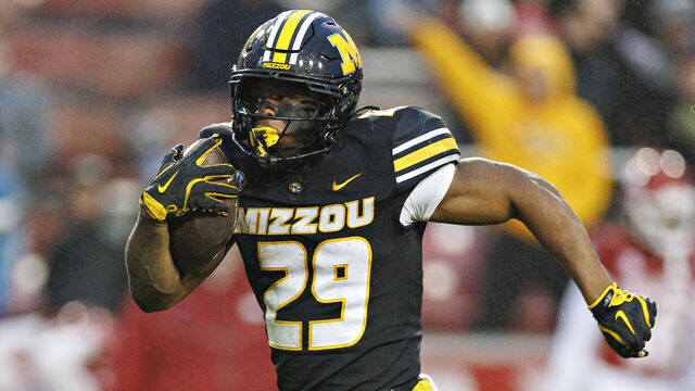 FAYETTEVILLE, ARKANSAS - NOVEMBER 29: Ahmad Hardy #29 of the Missouri Tigers rushes for a touchdown during a game against the Arkansas Razorbacks at Donald W. Reynolds Razorback Stadium on November 29, 2025 in Fayetteville, Arkansas. The Tigers defeated the Razorbacks 31-17.