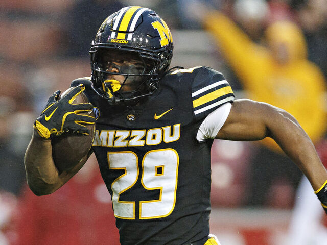 FAYETTEVILLE, ARKANSAS - NOVEMBER 29: Ahmad Hardy #29 of the Missouri Tigers rushes for a touchdown during a game against the Arkansas Razorbacks at Donald W. Reynolds Razorback Stadium on November 29, 2025 in Fayetteville, Arkansas. The Tigers defeated the Razorbacks 31-17.