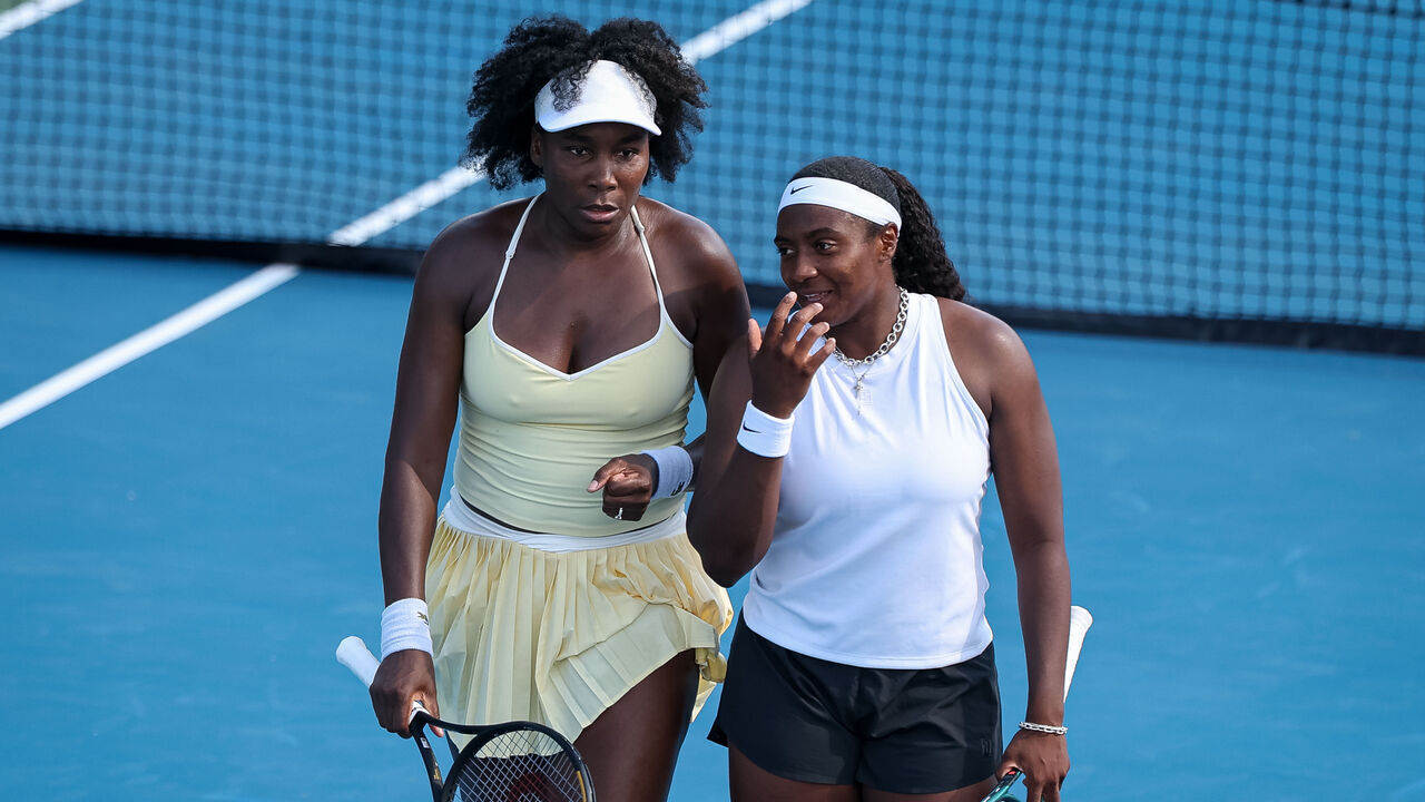 WASHINGTON, DC - JULY 21: Venus Williams and Hailey Baptiste interact during a women's doubles match against Eugenie Bouchard and Cleave Ngounoue (not pictured) on day 1 of the Mubadala Citi DC Open 2025 at William H.G. FitzGerald Tennis Center on July 21, 2025 in Washington, DC.