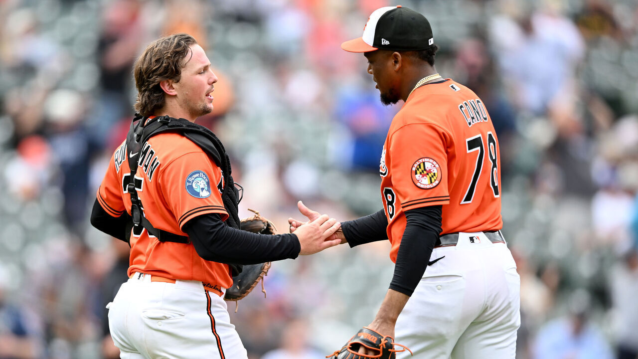 BALTIMORE, MARYLAND - MAY 13: Yennier Cano #78 of the Baltimore Orioles celebrates with Adley Rutschman #35 after a 7-0 victory against the New York Yankees at Oriole Park at Camden Yards on May 13, 2026 in Baltimore, Maryland.