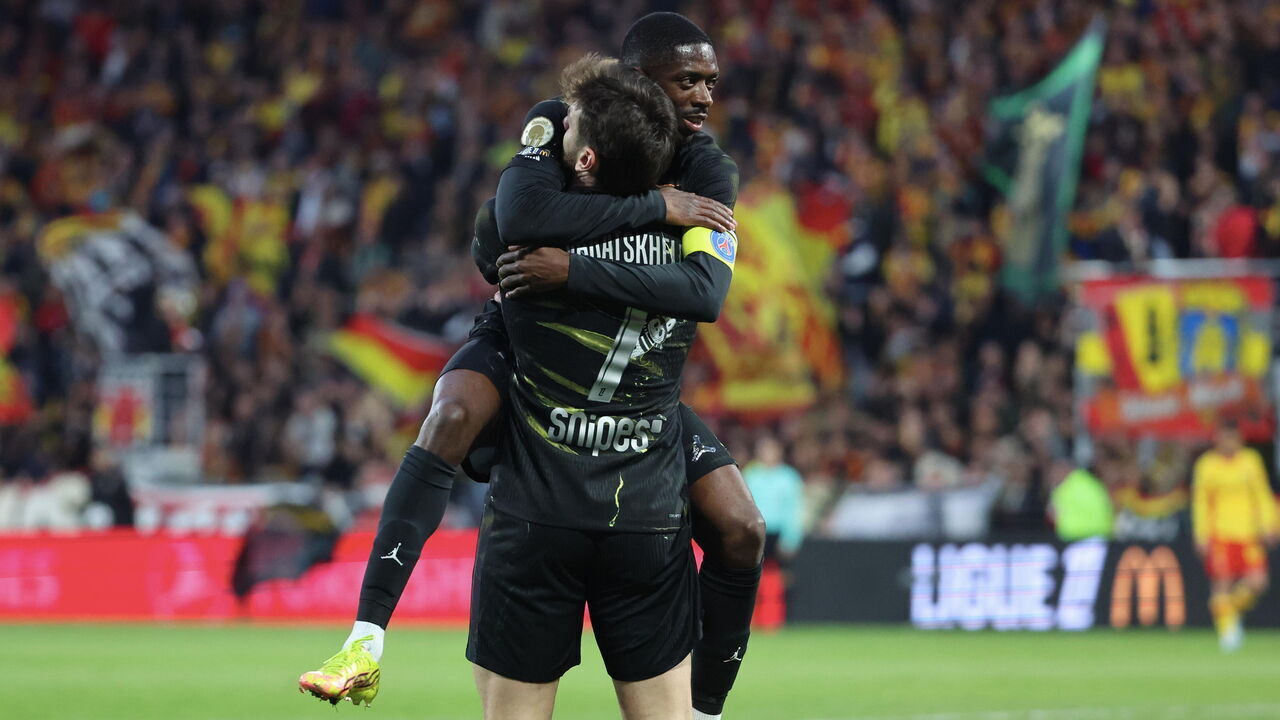 LENS, FRANCE - MAY 13: Khvicha Kvaratskhelia #7 of Paris Saint-Germain celebrate his first goal with Ousmane Dembélé #10 during the Ligue 1 McDonald's match between RC Lens and Paris Saint-Germain at Stade Bollaert-Delelis on May 13, 2026 in Lens, France.