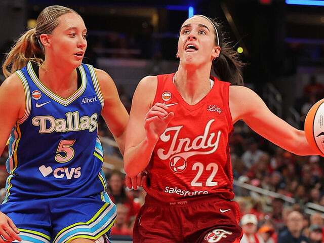 INDIANAPOLIS, IN - MAY 9: Caitlin Clark #22 of the Indiana Fever drives to the basket while guarded by Paige Bueckers #5 of the Dallas Wings on May 9, 2026 at the Gainbridge Fieldhouse inIndianapolis, Indiana. Mandatory Copyright Notice: Copyright 2026 NBAE