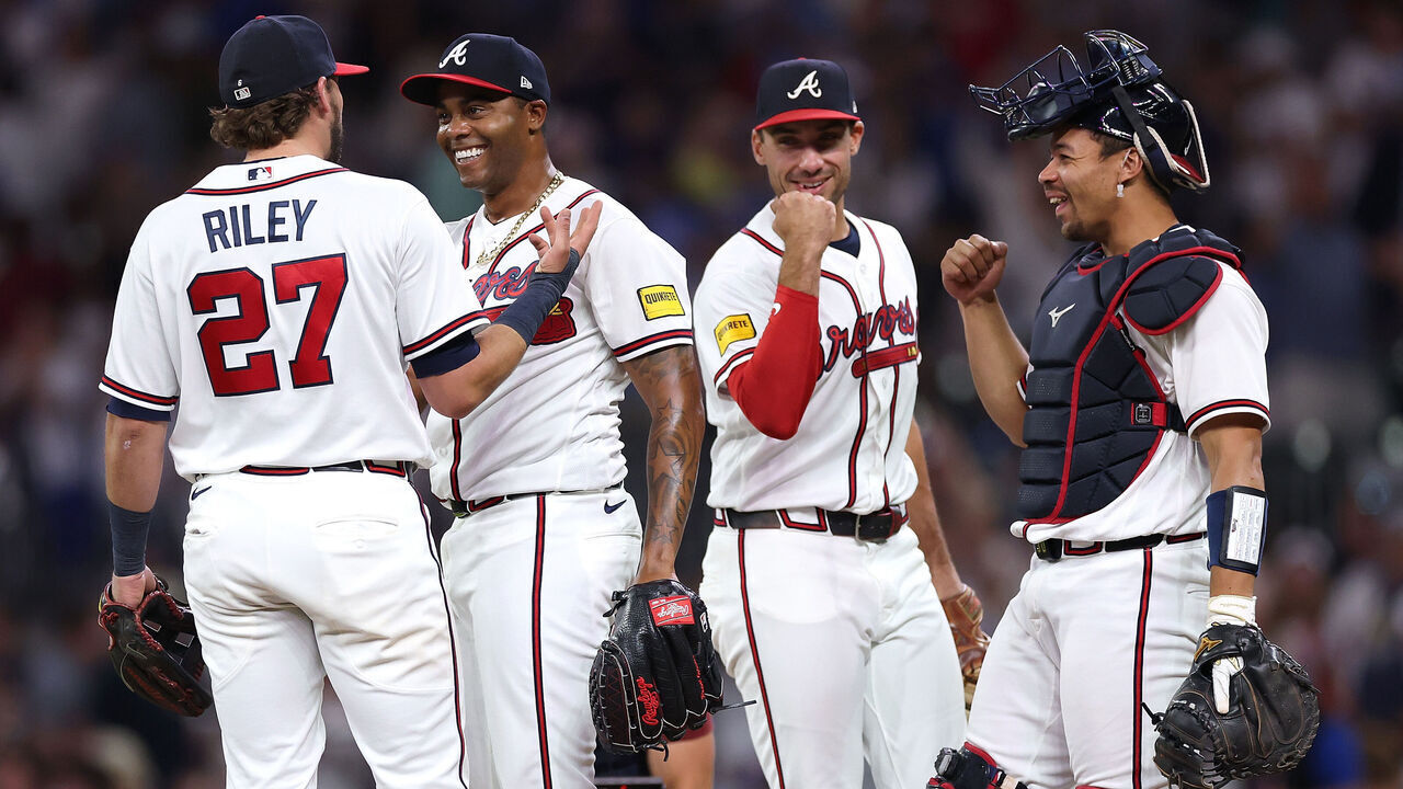 ATLANTA, GEORGIA - MAY 13: Raisel Iglesias #26 of the Atlanta Braves reacts with Austin Riley #27, Matt Olson #28, Drake Baldwin #30 after their 4-1 win over the Chicago Cubs at Truist Park on May 13, 2026 in Atlanta, Georgia.
