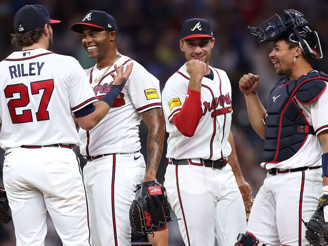 ATLANTA, GEORGIA - MAY 13: Raisel Iglesias #26 of the Atlanta Braves reacts with Austin Riley #27, Matt Olson #28, Drake Baldwin #30 after their 4-1 win over the Chicago Cubs at Truist Park on May 13, 2026 in Atlanta, Georgia.