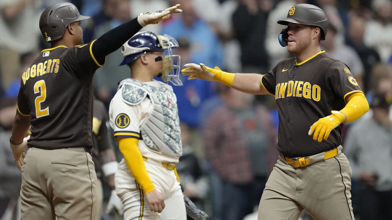 MILWAUKEE, WISCONSIN - MAY 13: Gavin Sheets #30 of the San Diego Padres celebrates with teammate Xander Bogaerts #2 after hitting a three-run home run against the Milwaukee Brewers during the ninth inning at American Family Field on May 13, 2026 in Milwaukee, Wisconsin.