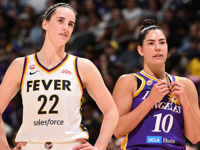 LOS ANGELES, CA - MAY 13: Caitlin Clark #22 of the Indiana Fever and Kelsey Plum #10 of the Los Angeles Sparks look on during the game on May 13, 2026 at Crypto.com Arena in Los Angeles, California. NOTE TO USER: User expressly acknowledges and agrees that, by downloading and/or using this Photograph, user is consenting to the terms and conditions of the Getty Images License Agreement. Mandatory Copyright Notice: Copyright 2026 NBAE