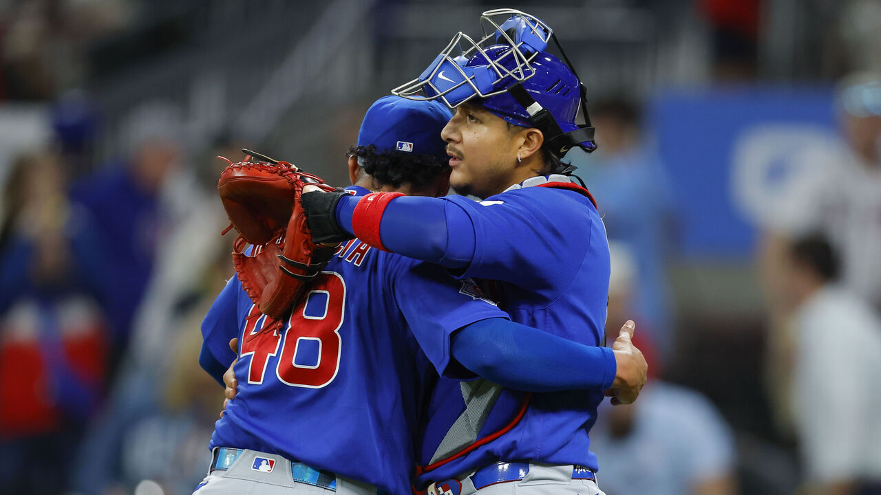ATLANTA, GEORGIA - MAY 14: Daniel Palencia #48 and Miguel Amaya #9 of the Chicago Cubs embrace following a 2-0 victory over the Atlanta Braves at Truist Park on May 14, 2026 in Atlanta, Georgia.