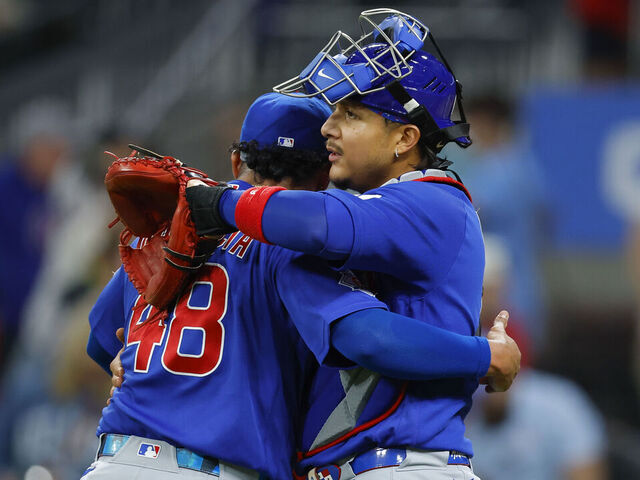 ATLANTA, GEORGIA - MAY 14: Daniel Palencia #48 and Miguel Amaya #9 of the Chicago Cubs embrace following a 2-0 victory over the Atlanta Braves at Truist Park on May 14, 2026 in Atlanta, Georgia.