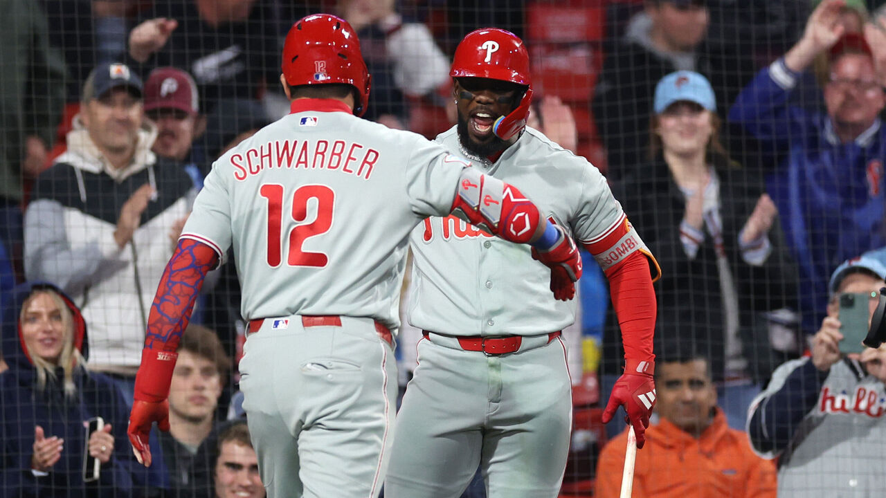 BOSTON, MASSACHUSETTS - MAY 14: Adolis Garcia #53 and Kyle Schwarber #12 of the Philadelphia Phillies celebrate during the eighth inning against the Boston Red Sox at Fenway Park on May 14, 2026 in Boston, Massachusetts.
