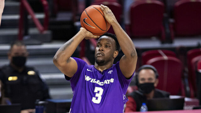 FAYETTEVILLE, ARKANSAS - DECEMBER 22: Airion Simmons #3 of the Abilene Christian Wildcats shoots the ball during a game against the Arkansas Razorbacks at Bud Walton Arena on December 22, 2020 in Fayetteville, Arkansas. The Razorbacks defeated the Wildcats 85-72.