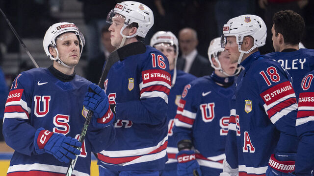 USA's team players react at the end of the IIHF Ice Hockey Men's World Championship first round group A ice hockey match between USA and Switzerland at the Swiss Life Arena, in Zurich, on May 15, 2026. Switzerland wins 3 - 1 against the USA.