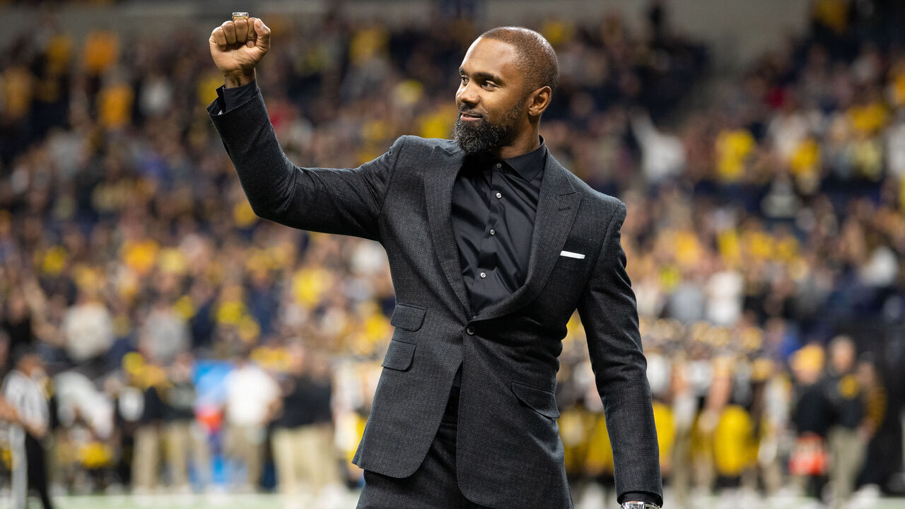 INDIANAPOLIS, IN - DECEMBER 04: Former Michigan Wolverines player Charles Woodson is honored during the Big 10 Championship game between the Michigan Wolverines and Iowa Hawkeyes on December 4, 2021, at Lucas Oil Stadium in Indianapolis, IN.