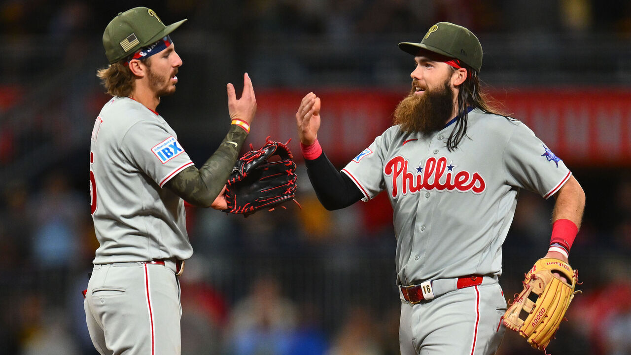 PITTSBURGH, PENNSYLVANIA - MAY 15: Brandon Marsh #16 (R) and Bryson Stott #5 of the Philadelphia Phillies celebrate after an 11-9 win over the Pittsburgh Pirates at PNC Park on May 15, 2026 in Pittsburgh, Pennsylvania.