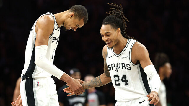 MINNEAPOLIS, MINNESOTA - MAY 15: Victor Wembanyama #1 and Devin Vassell #24 of the San Antonio Spurs celebrate during the second quarter of a game against the Minnesota Timberwolves in Game Six of the Second Round of the NBA Western Conference Playoffs at Target Center on May 15, 2026 in Minneapolis, Minnesota.