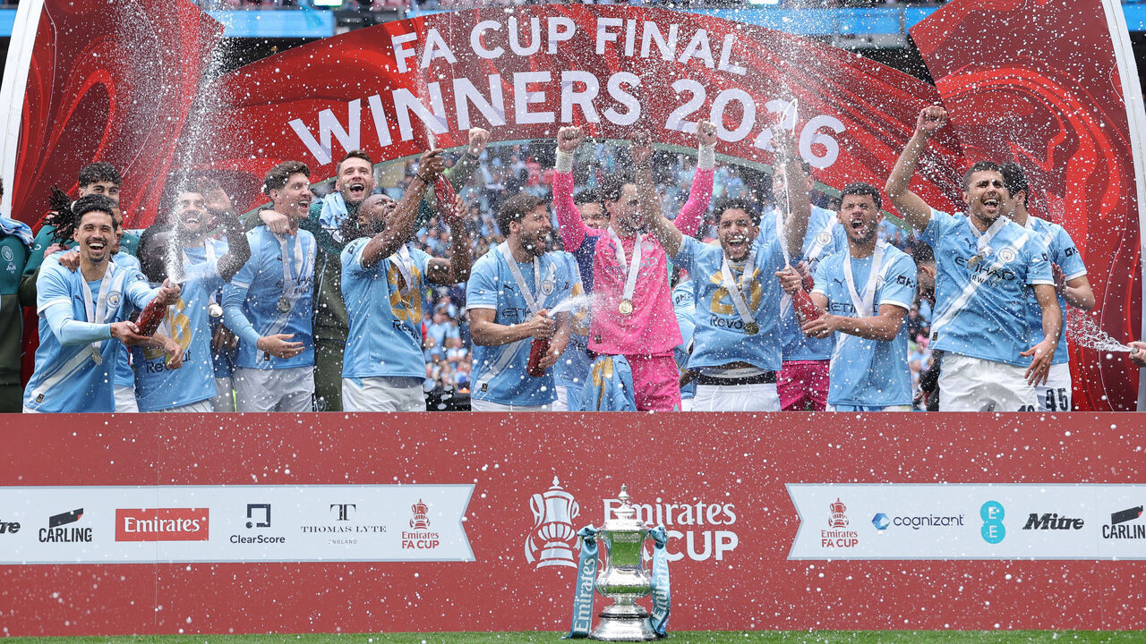 LONDON, ENGLAND - MAY 16: Players and staff of Manchester City celebrate with the FA Cup trophy after the Emirates FA Cup Final match between Chelsea and Manchester City on May 16, 2026 in London, England.