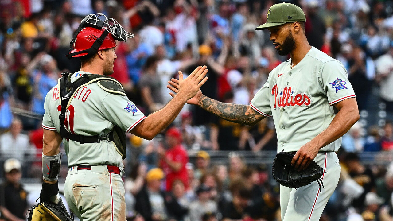 PITTSBURGH, PENNSYLVANIA - MAY 16: Cristopher Sánchez #61 of the Philadelphia Phillies celebrates with teammate J.T. Realmuto #10 after pitching a complete game in a 6-0 win over the Pittsburgh Pirates during the game at PNC Park on May 16, 2026 in Pittsburgh, Pennsylvania.