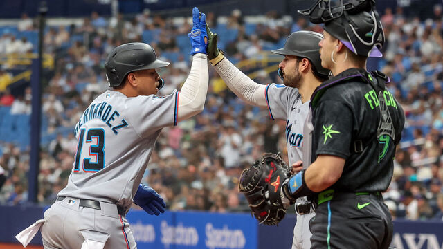 ST. PETERSBURG, FL - MAY 16: Heriberto Hernández #13 of the Miami Marlins celebrates his home run with Joe Mack #80 in front of Hunter Feduccia #9 of the Tampa Bay Rays during the seventh inning of the baseball game at Tropicana Field on May 16, 2026 in St. Petersburg, Florida.