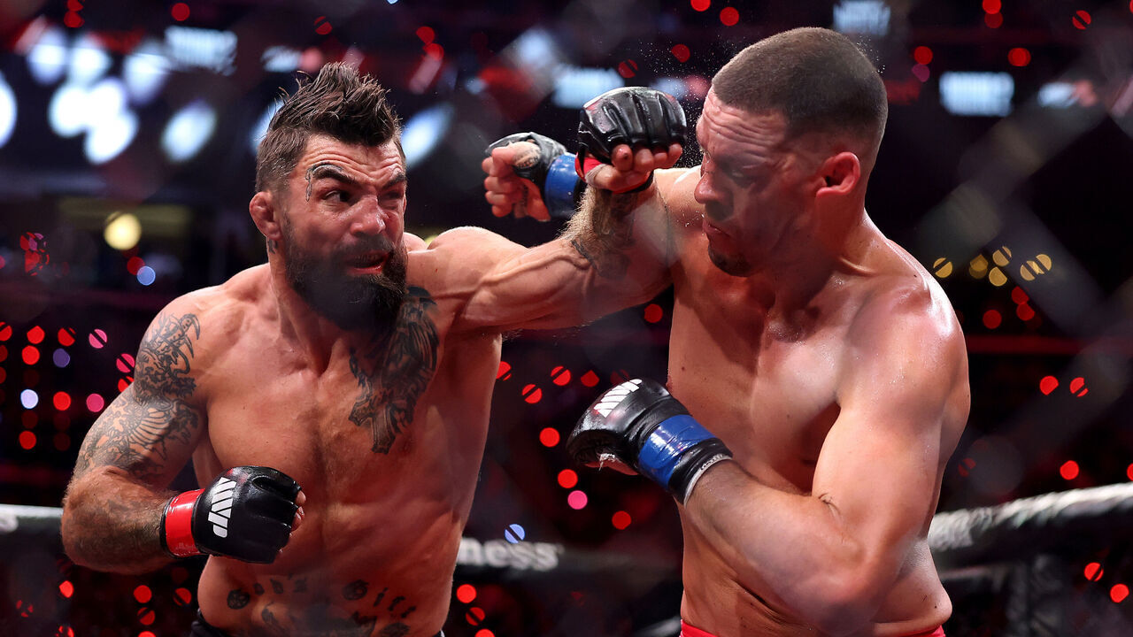 INGLEWOOD, CALIFORNIA - MAY 16: Mike Perry strikes Nate Diaz in their welterweight bout during the main card of Netflix's Ronda Rousey vs. Gina Carano at Intuit Dome on May 16, 2026 in Inglewood, California.