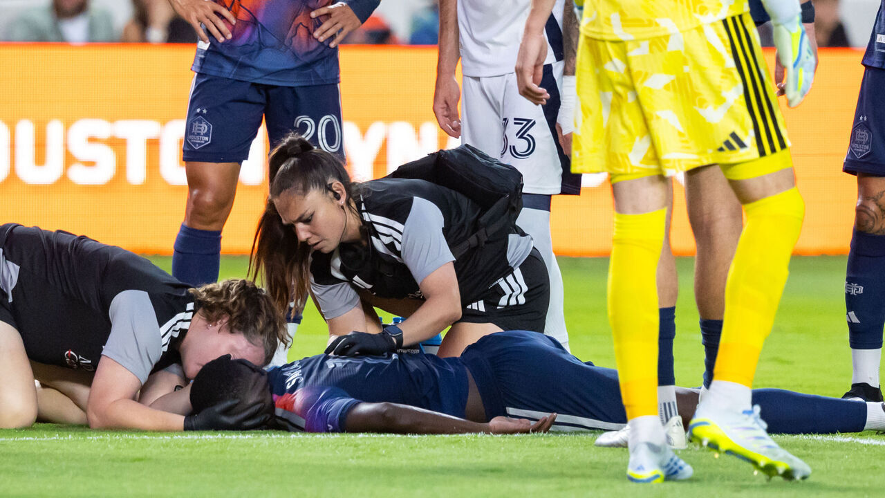 HOUSTON, TEXAS - MAY 16: Diadie Samassekou #18 of the Houston Dynamo FC is attended to by team trainer after an injury during the first half of a game against the Vancouver Whitecaps FC at Shell Energy Stadium on May 16, 2026 in Houston, Texas.