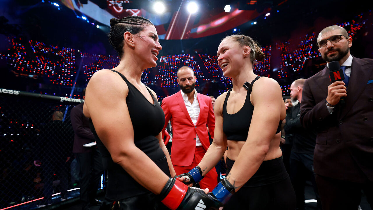 INGLEWOOD, CALIFORNIA - MAY 16: Ronda Rousey and Gina Carano embrace after their featherweight bout during the main card of Netflix's Ronda Rousey vs. Gina Carano at Intuit Dome on May 16, 2026 in Inglewood, California.