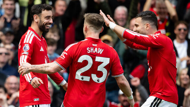 MANCHESTER, ENGLAND - MAY 17: Bruno Fernandes, Luke Shaw and Diogo Dalot of Manchester United celebrate after Bryan Mbeumo of Manchester United (not pictured) scores his teams third goal during the Premier League match between Manchester United and Nottingham Forest at Old Trafford on May 17, 2026 in Manchester, England.