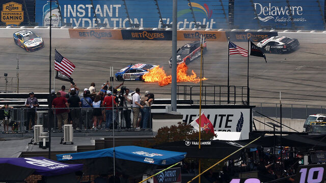DOVER, DELAWARE - MAY 17: Ryan Preece, driver of the #60 Mohawk Northeast Inc. Ford, in flames Todd Gilliland, driver of the #34 Long John Silver's/Frank's Red Hot Ford, Daniel Suarez, driver of the #7 Cal Ripken Sr. Foundation Chevrolet, and Cole Custer, driver of the #41 Haas/Autodesk Chevrolet, spin after an on-track incident during the NASCAR Cup Series All-Star Race at Dover Motor Speedway on May 17, 2026 in Dover, Delaware.