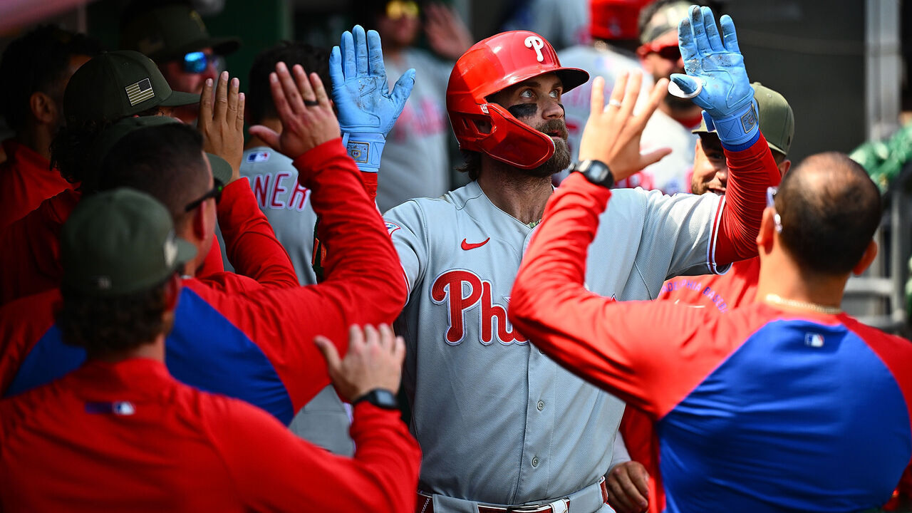 PITTSBURGH, PENNSYLVANIA - MAY 17: Bryce Harper #3 of the Philadelphia Phillies celebrates with teammates in the dugout after hitting a solo home run in the sixth inning during the game against the Pittsburgh Pirates at PNC Park on May 17, 2026 in Pittsburgh, Pennsylvania.