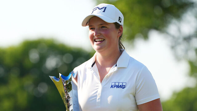 CINCINNATI, OHIO - MAY 17: Lottie Woad of England celebrates with the trophy on the 18th green after winning the Kroger Queen City Championship presented by P&G 2026 at Maketewah Country Club on May 17, 2026 in Cincinnati, Ohio.