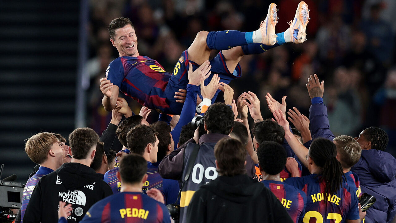 BARCELONA, SPAIN - MAY 17: Robert Lewandowski of FC Barcelona is hoisted by teammates after the LaLiga EA Sports match between FC Barcelona and Real Betis Balompie at Spotify Camp Nou on May 17, 2026 in Barcelona, Spain.