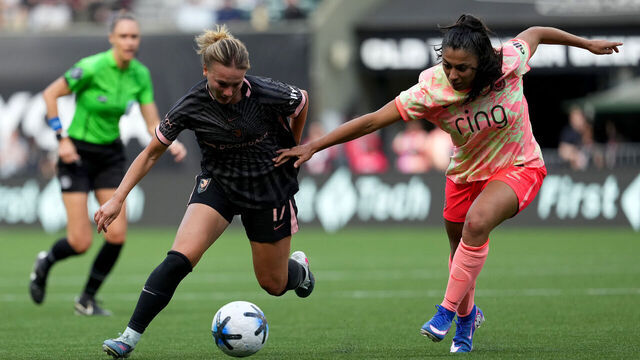 PORTLAND, OREGON - MAY 17: Kennedy Fuller #17 of Angel City FC controls the ball whilst under pressure from Reyna Reyes #2 of Portland Thorns FC during the NWSL match between Portland Thorns FC and Angel City FC at Providence Park on May 17, 2026 in Portland, Oregon.