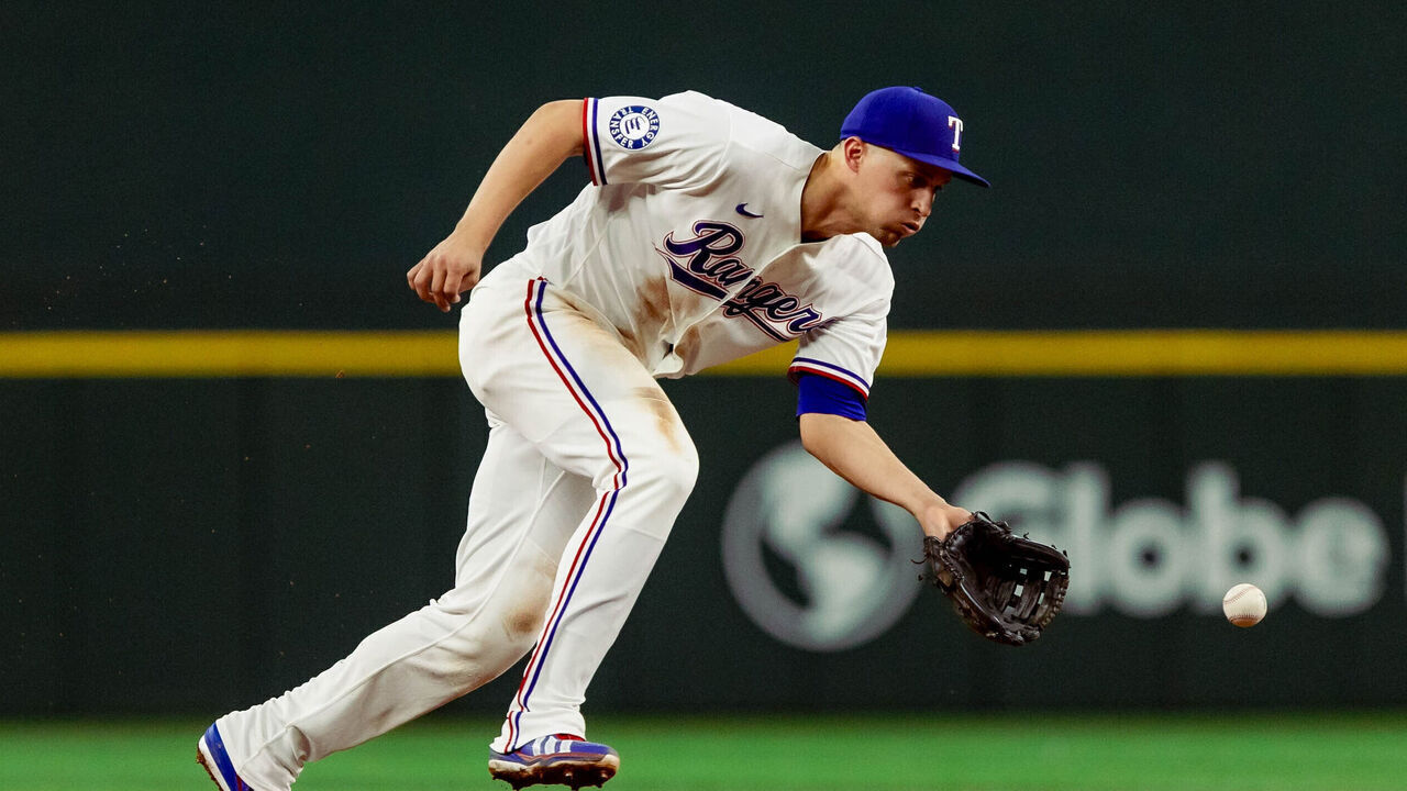 ARLINGTON, TX - MAY 12: Corey Seager #5 of the Texas Rangers fields a ground ball during the game between the Arizona Diamondbacks and the Texas Rangers at Globe Life Field on Tuesday, May 12, 2026 in Arlington, Texas.