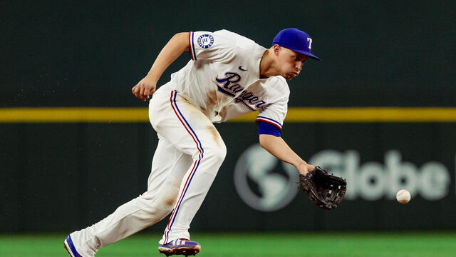 ARLINGTON, TX - MAY 12: Corey Seager #5 of the Texas Rangers fields a ground ball during the game between the Arizona Diamondbacks and the Texas Rangers at Globe Life Field on Tuesday, May 12, 2026 in Arlington, Texas.