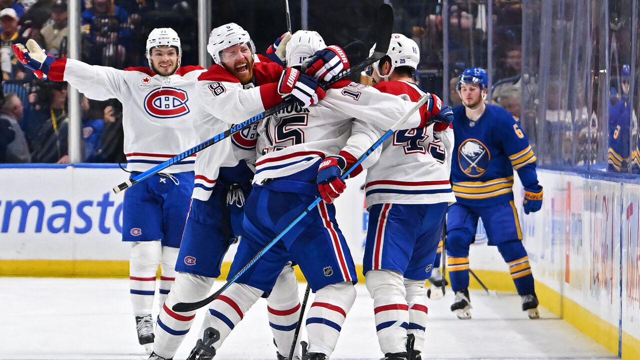 BUFFALO, NEW YORK - MAY 18: Alex Newhook #15 of the Montréal Canadiens celebrates with teammates after scoring a goal against the Buffalo Sabres during overtime in Game Seven of the Second Round of the 2026 Stanley Cup Playoffs at KeyBank Center on May 18, 2026 in Buffalo, New York.