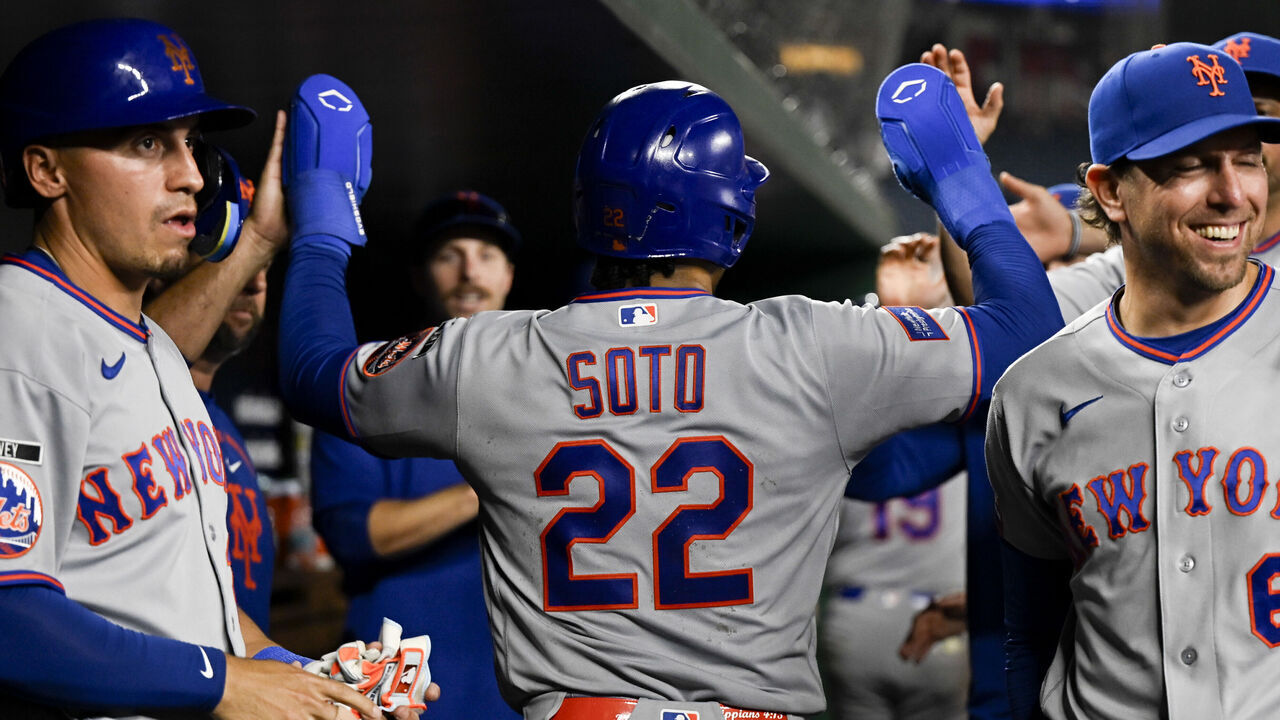 WASHINGTON, DC - MAY 18: Juan Soto #22 of the New York Mets celebrates with teammates in the dugout after scoring a run in the twelfth inning during the game between the New York Mets and the Washington Nationals at Nationals Park on Monday, May 18, 2026 in Washington, District of Columbia.